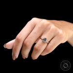Hand worn bluish grey moissanite ring