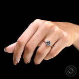 Hand worn bluish grey moissanite ring