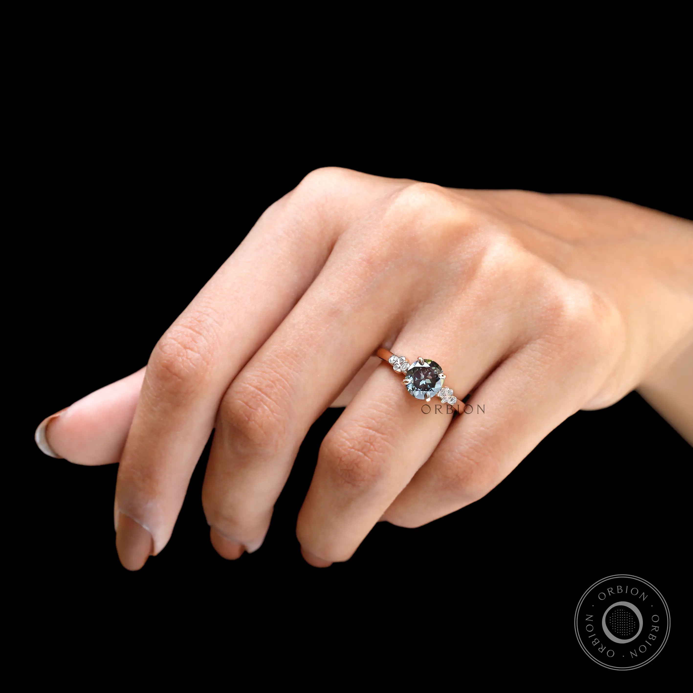 Hand worn bluish grey moissanite ring