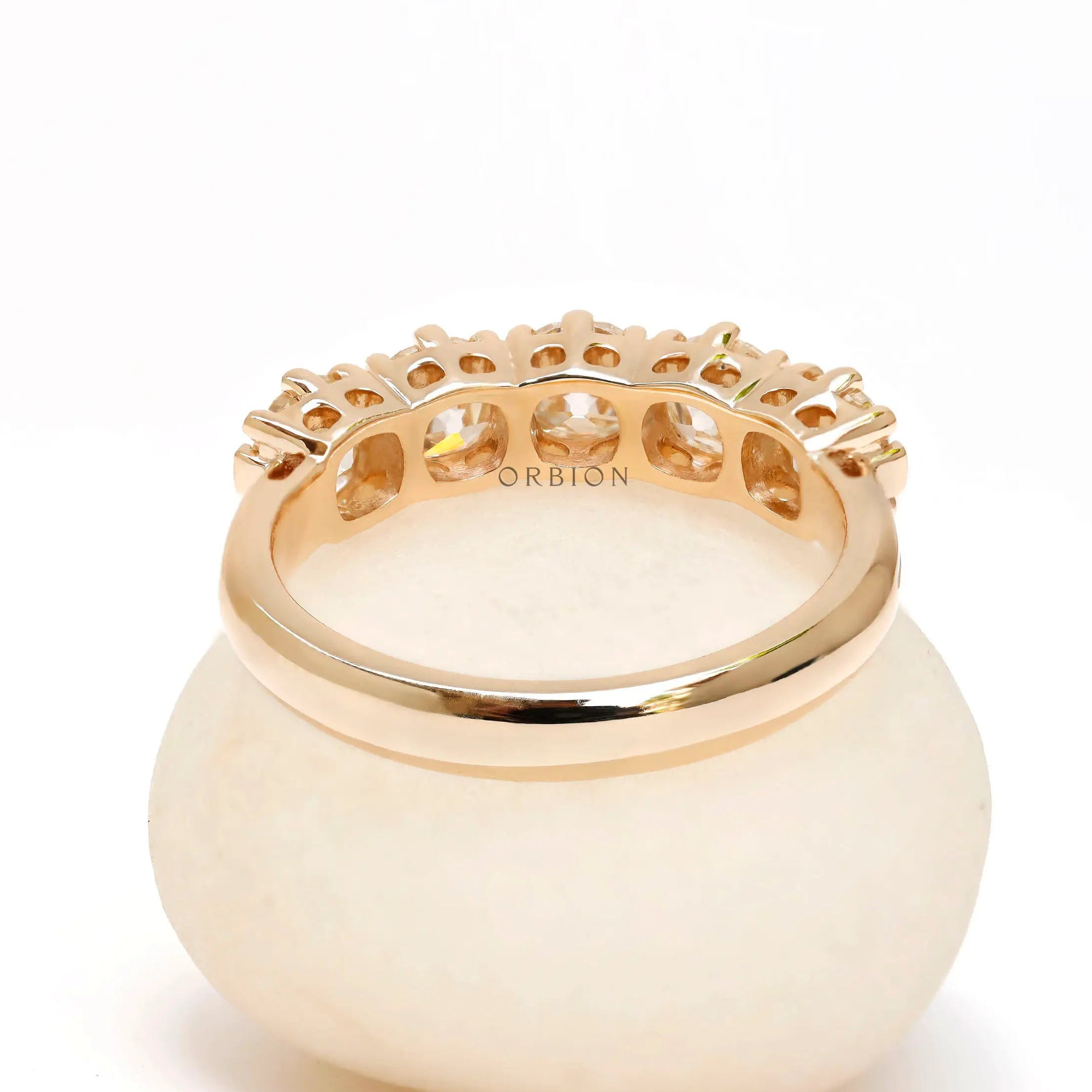 Interior view of five stone moissanite wedding band highlighting gallery details