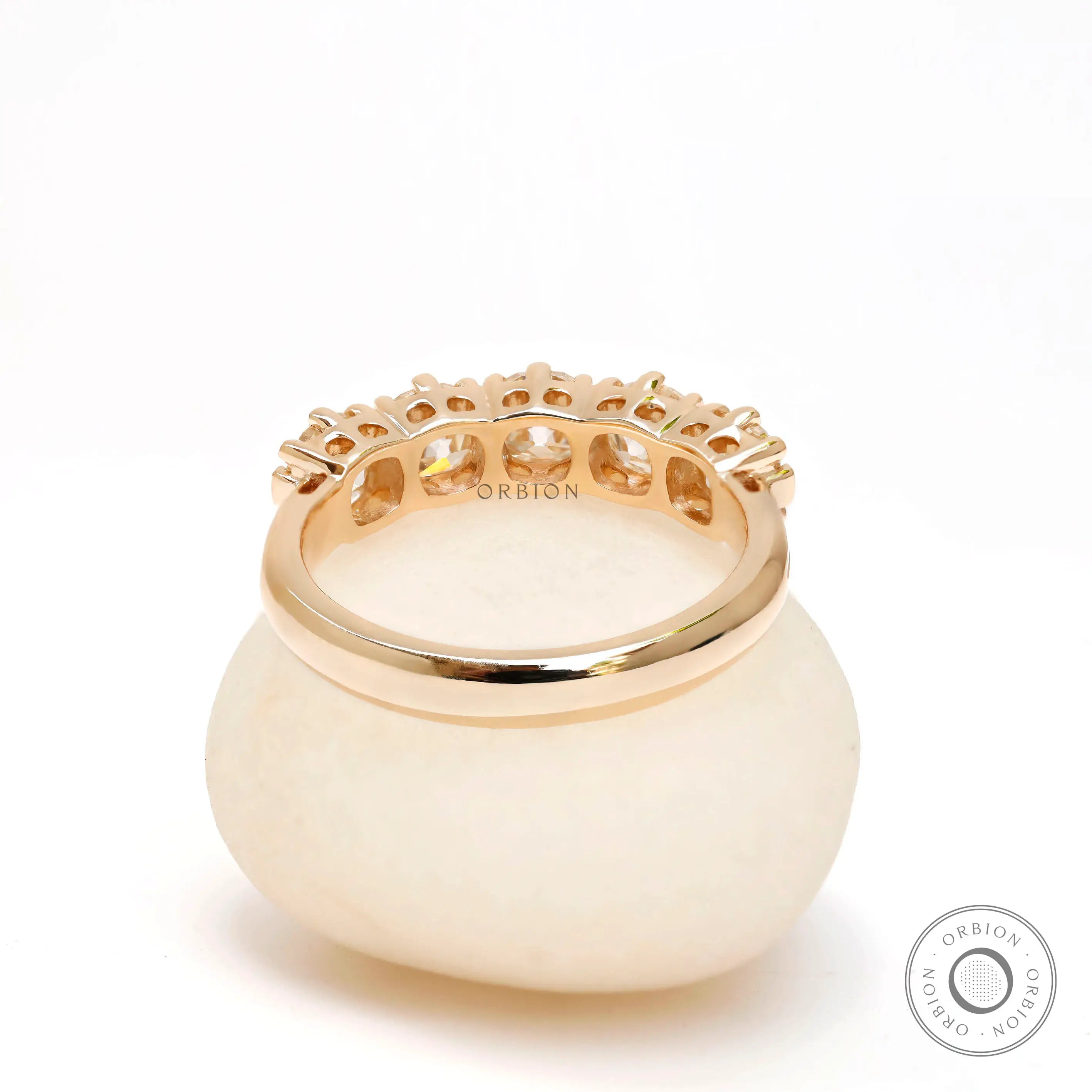 Interior view of five stone moissanite wedding band highlighting gallery details