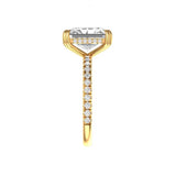 Radiant cut moissanite ring showing pave diamond band detail