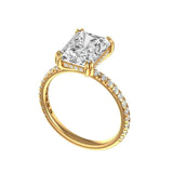 Yellow gold radiant engagement ring with double prong setting side profile