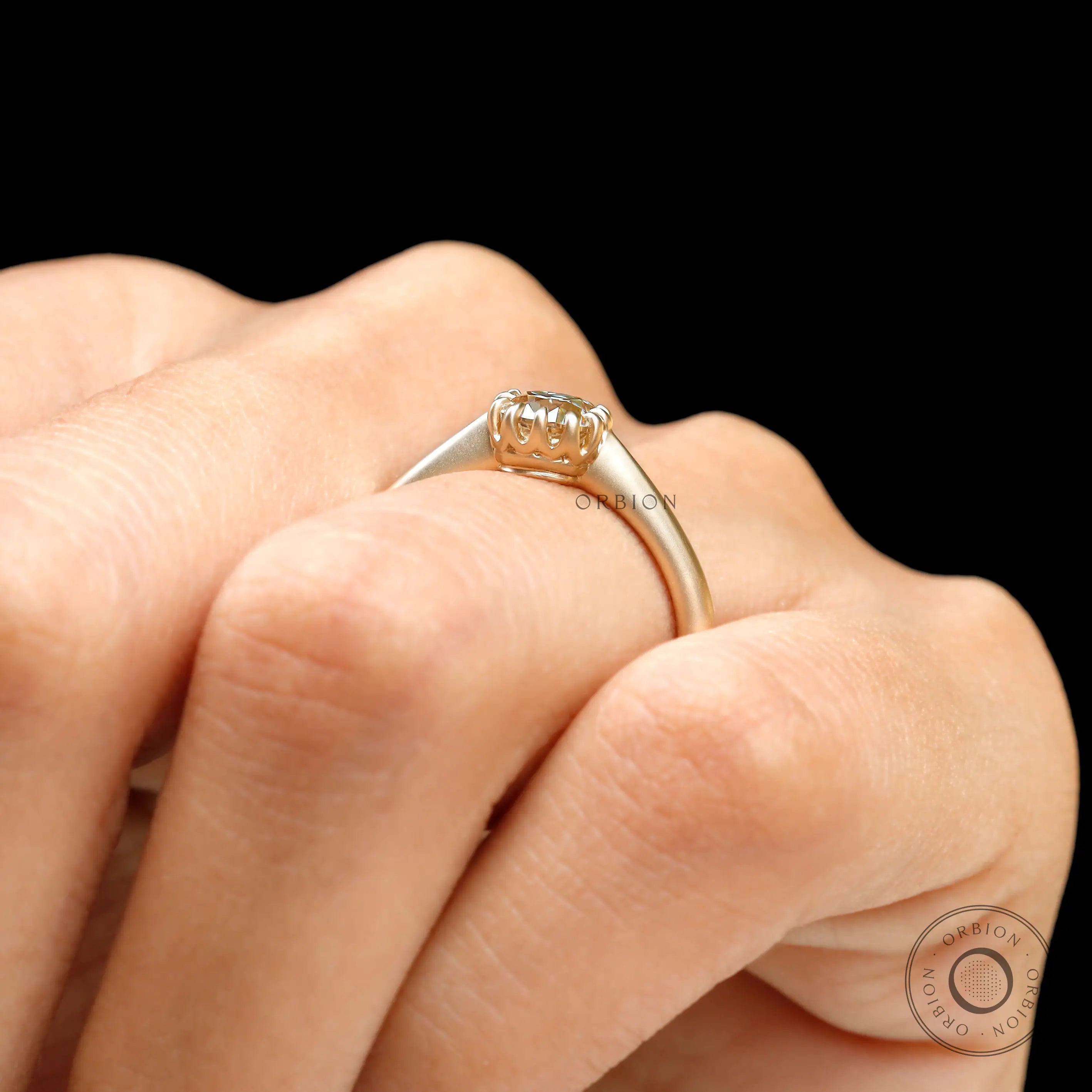 Solitaire ring worn on hand showcasing scale and proportions