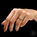 Light champagne elongated cushion moissanite engagement ring lifestyle view