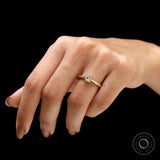 Light champagne elongated cushion moissanite engagement ring lifestyle view