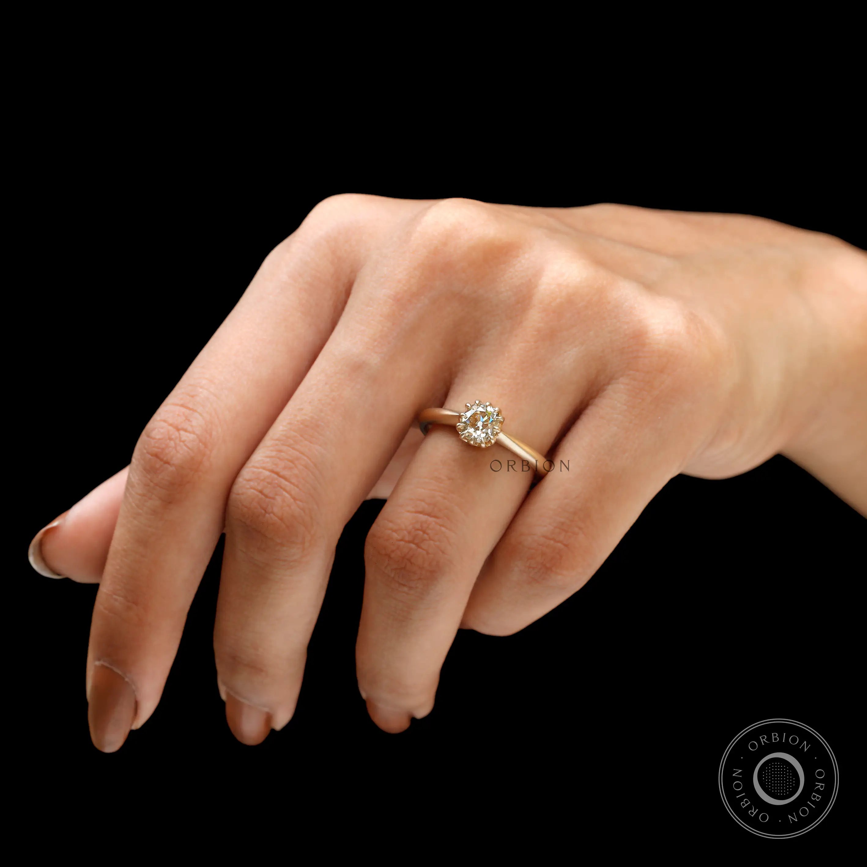 Light champagne elongated cushion moissanite engagement ring lifestyle view