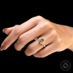 Elegant emerald cut champagne moissanite ring with baguette cluster