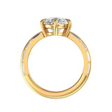 Side profile of vintage style pear moissanite ring set in 10k yellow gold