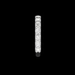 Side profile view round moissanite pave band in white gold on black background.
