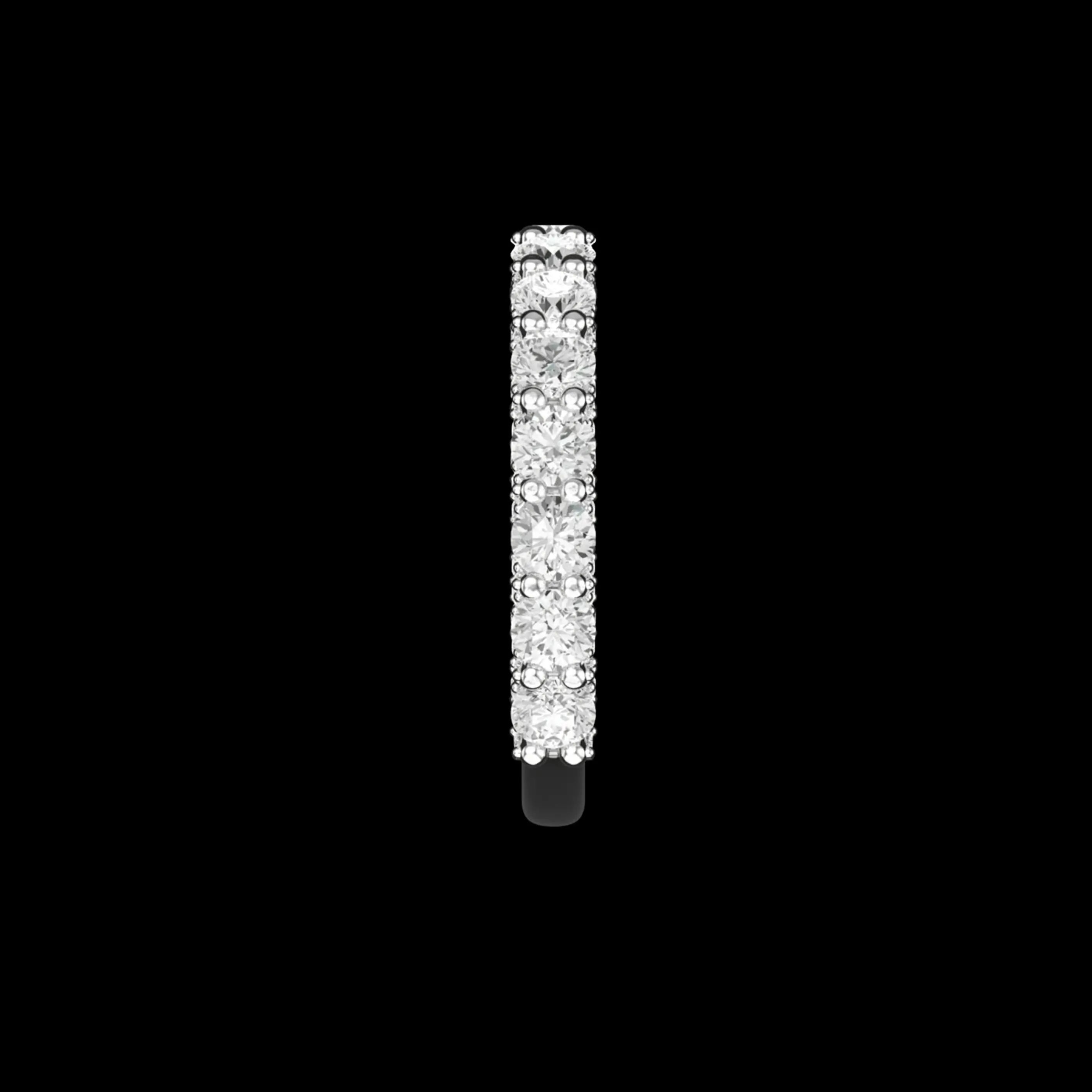 Side profile view round moissanite pave band in white gold on black background.