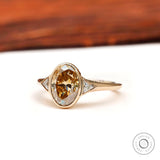 Oval champagne moissanite ring with triangle side stones