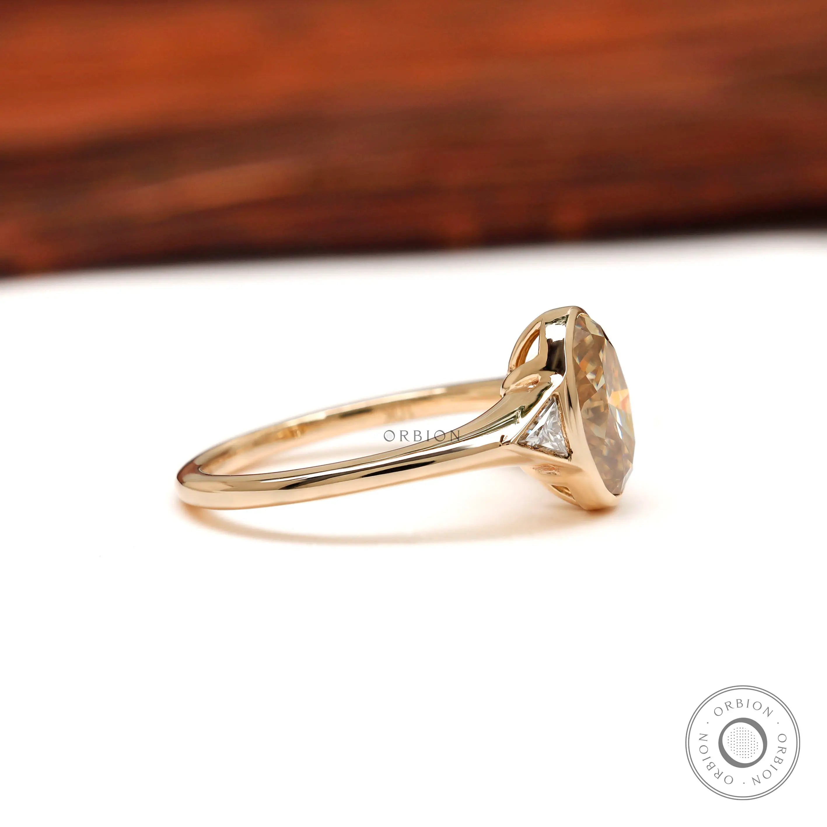 Side profile showing triangle moissanite accent stones