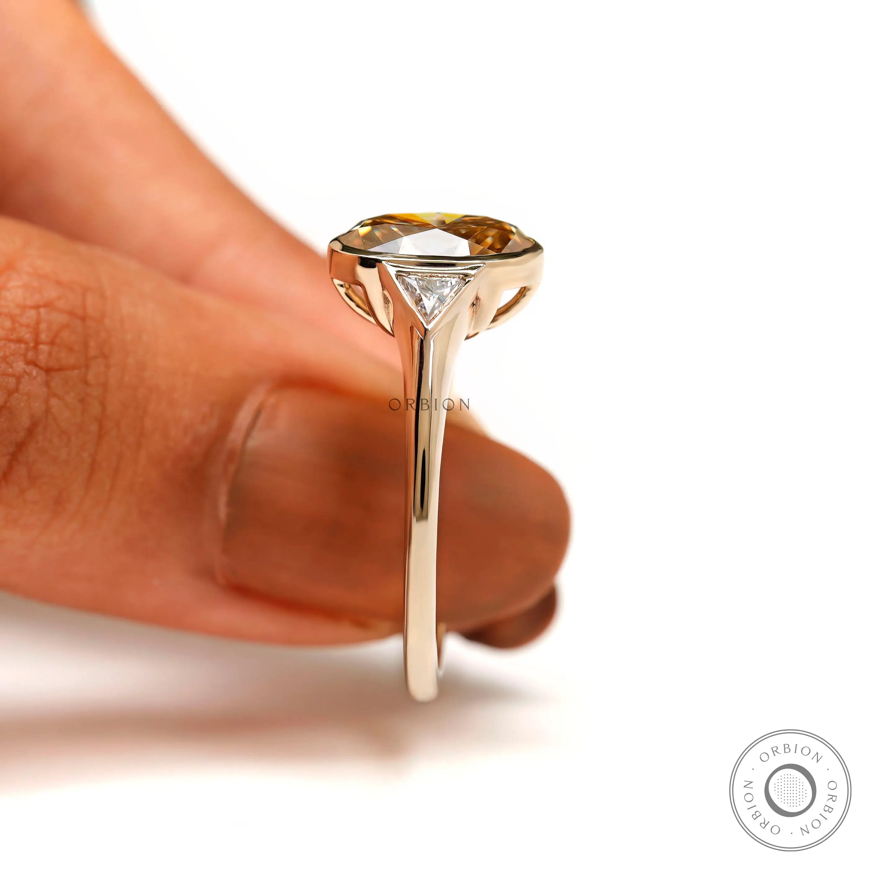 Close-up of oval moissanite brilliance and warm tones