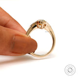 Under-gallery view of refined three stone ring design