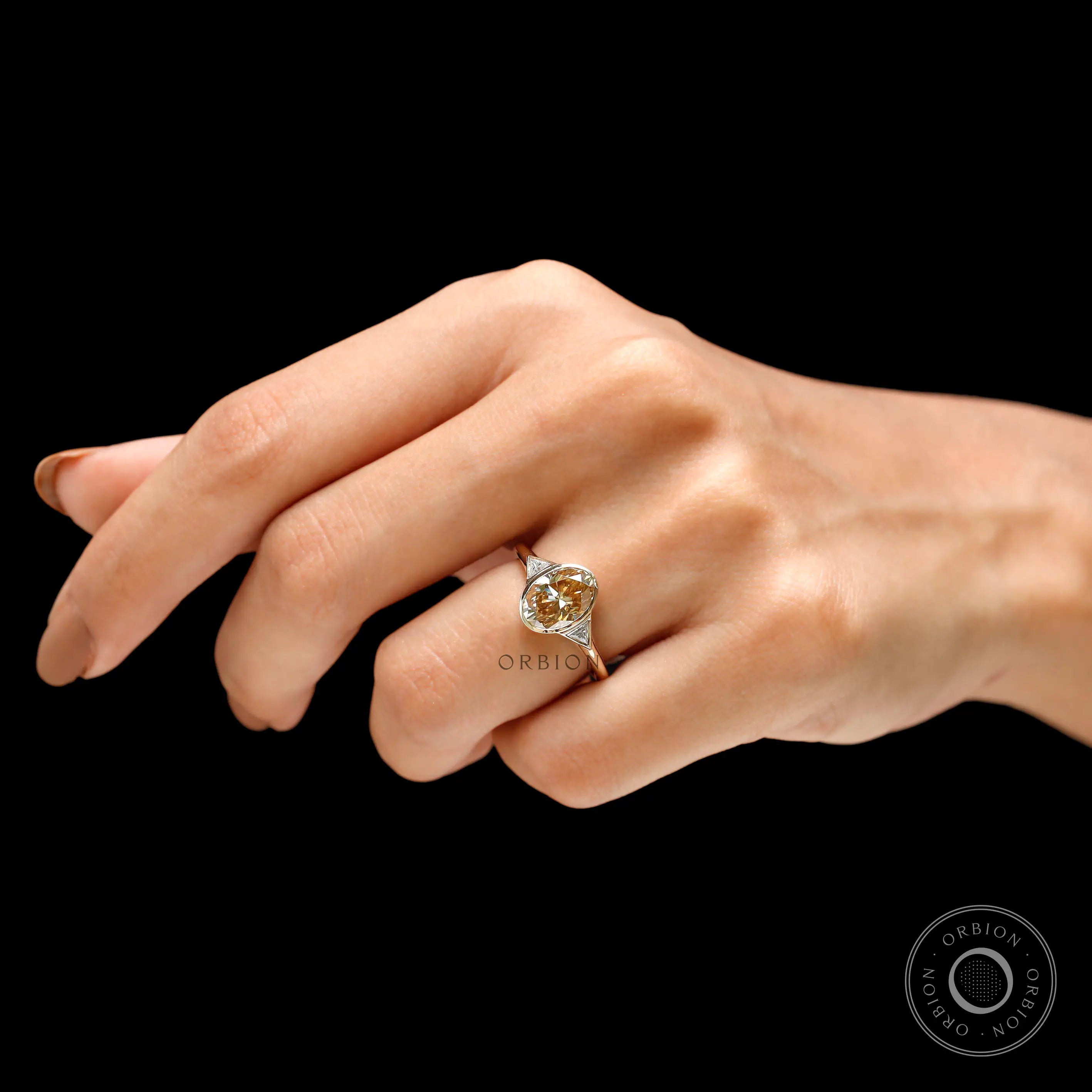 On-hand view showing elegant oval moissanite proportions