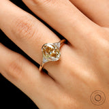 Lifestyle view of champagne moissanite engagement ring