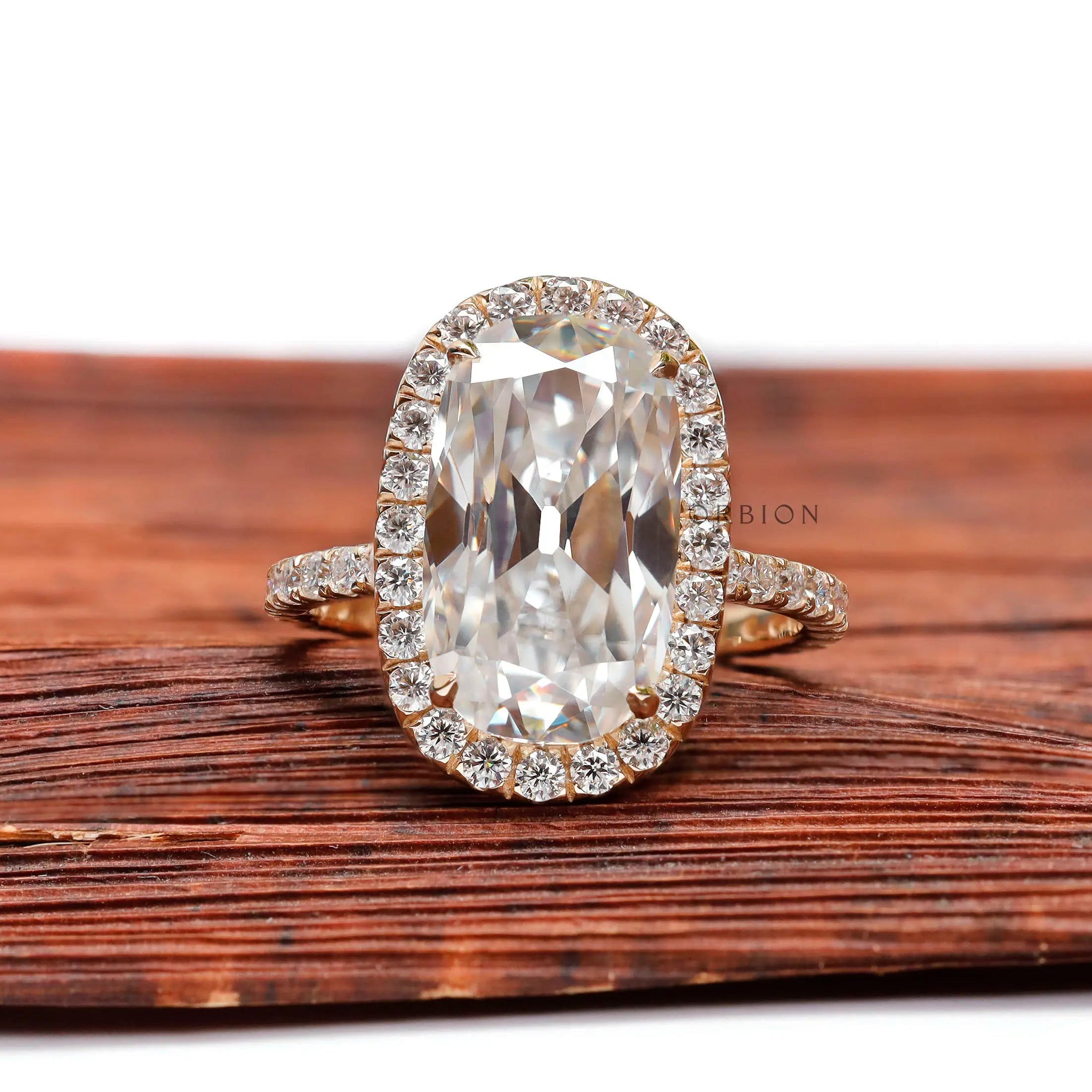 Front view of elongated cushion moissanite halo ring with pavé band