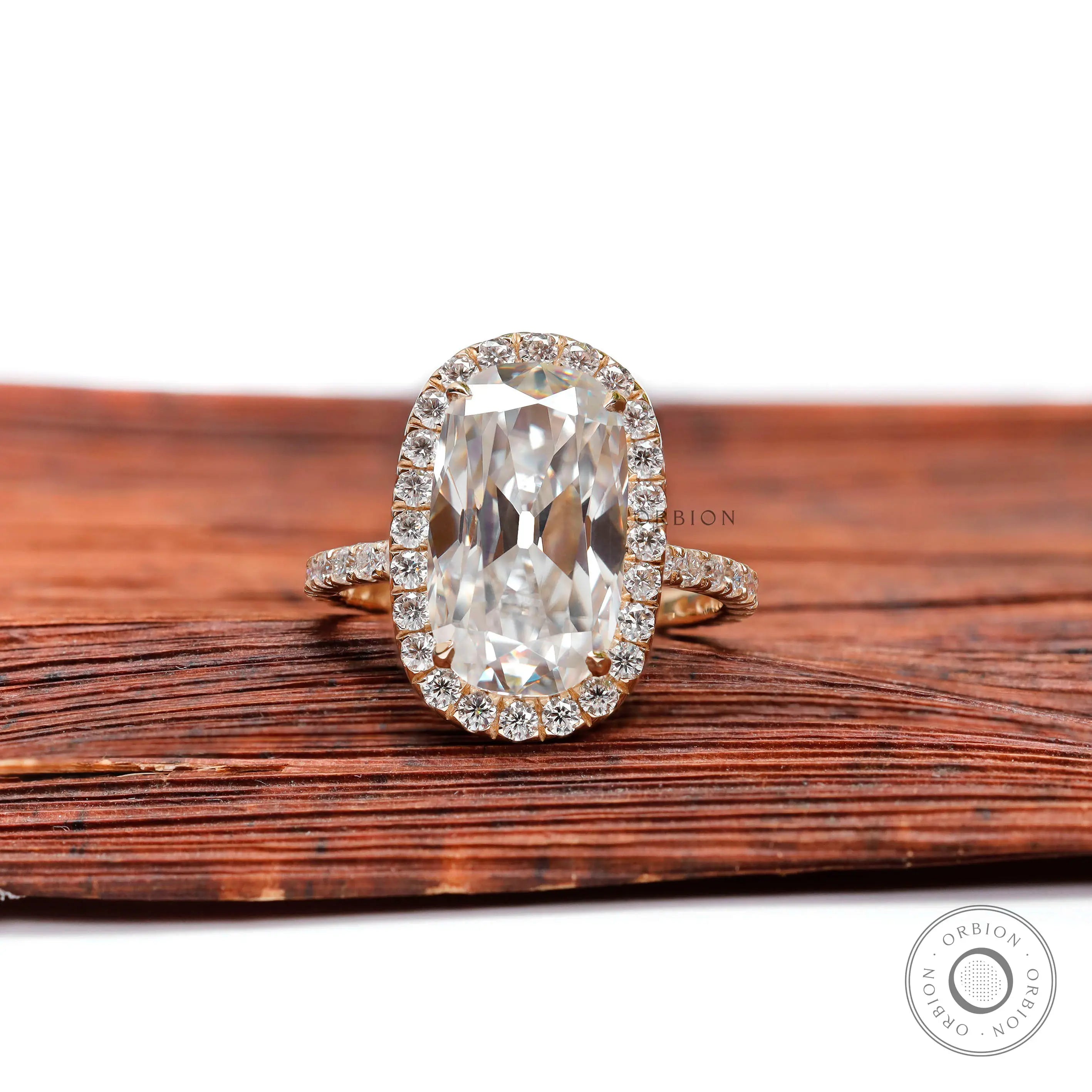 Front view of elongated cushion moissanite halo ring with pavé band