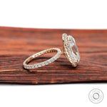 Side profile of elongated cushion moissanite halo ring in yellow gold