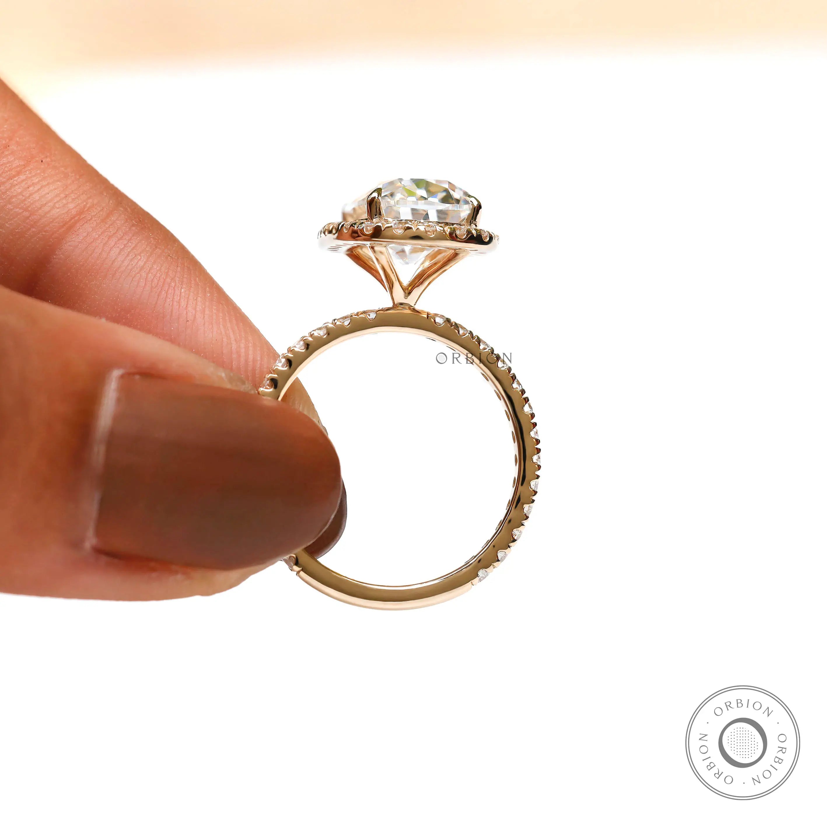 Elongated cushion old mine cut moissanite halo engagement ring in yellow gold