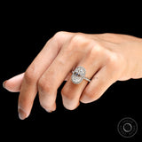 Elegant elongated cushion moissanite halo engagement ring worn on hand