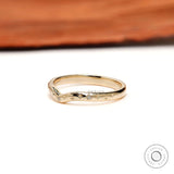 Angled view of curved nesting band featuring starburst details.