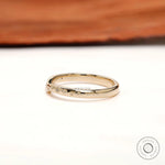 Side profile of curved stacking band showing starburst-inspired accents along the curve.