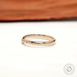 Side profile of curved stacking band showing starburst-inspired accents along the curve.