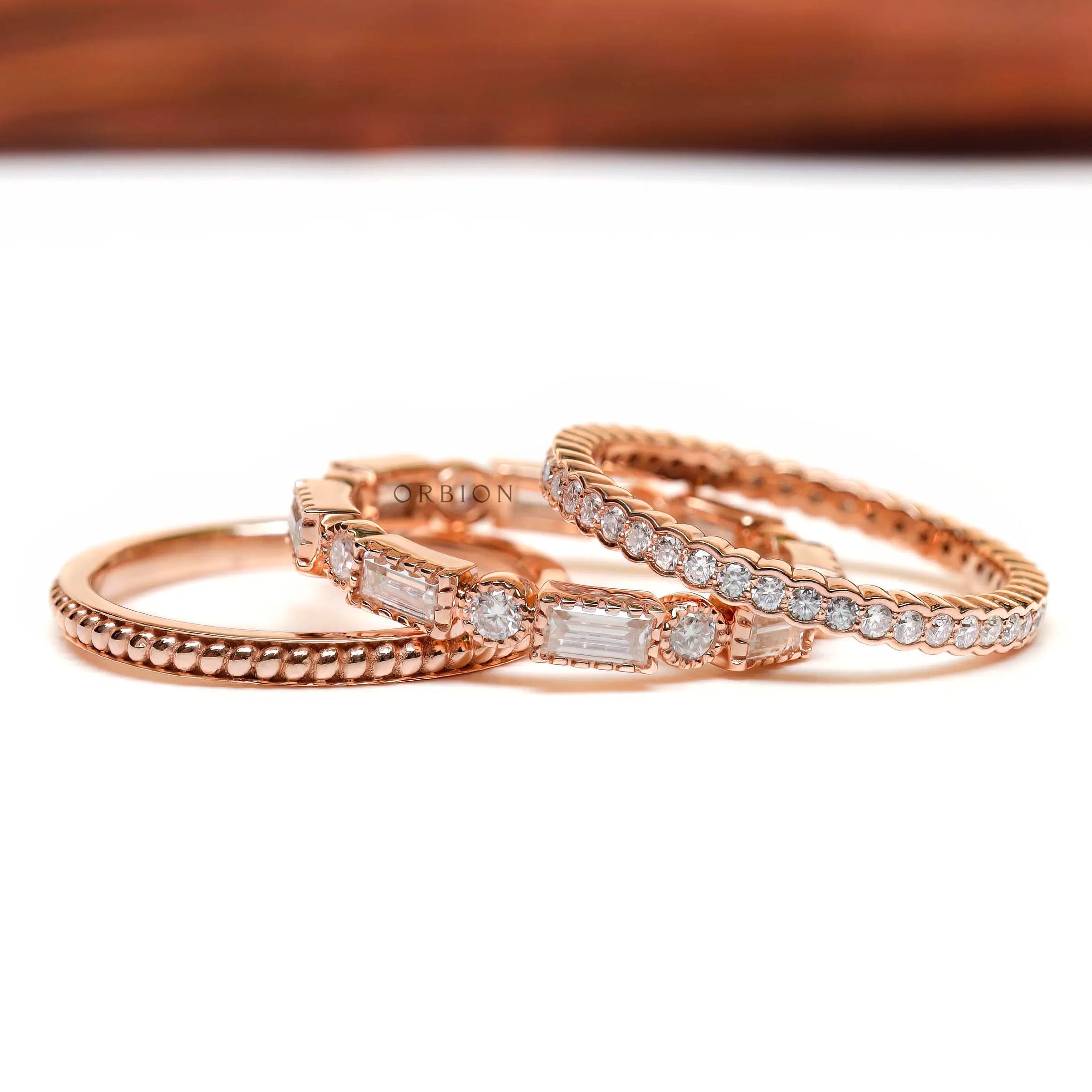 Layered trio bands showing twisted, pave, baguette details