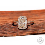 Radiant cut moissanite bezel set ring in rose gold