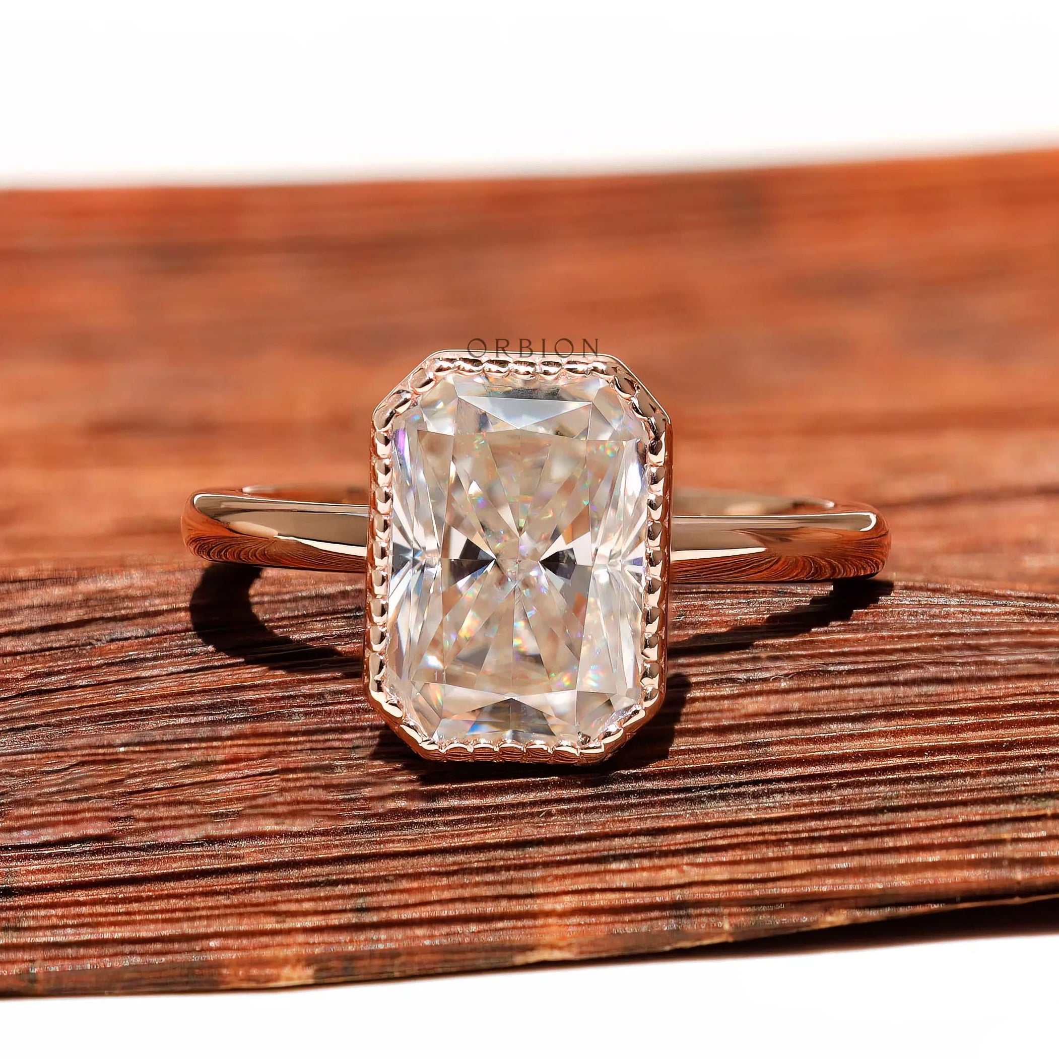 Radiant cut moissanite bezel set ring in rose gold