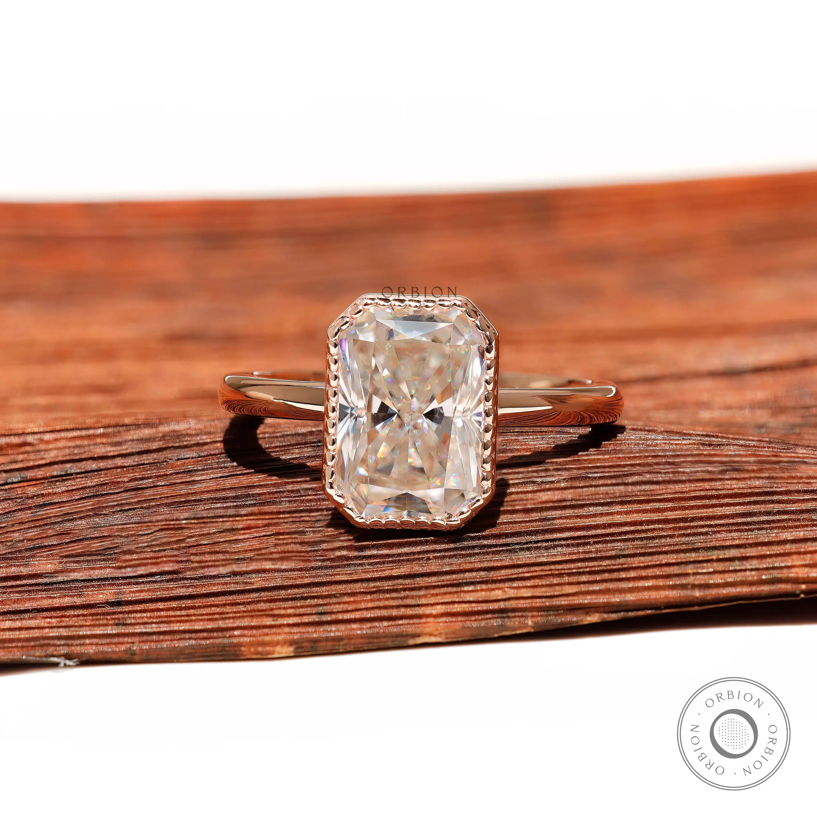 Radiant cut moissanite bezel set ring in rose gold
