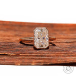 Rectangular radiant moissanite solitaire in bezel setting