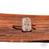 Rectangular radiant moissanite solitaire in bezel setting