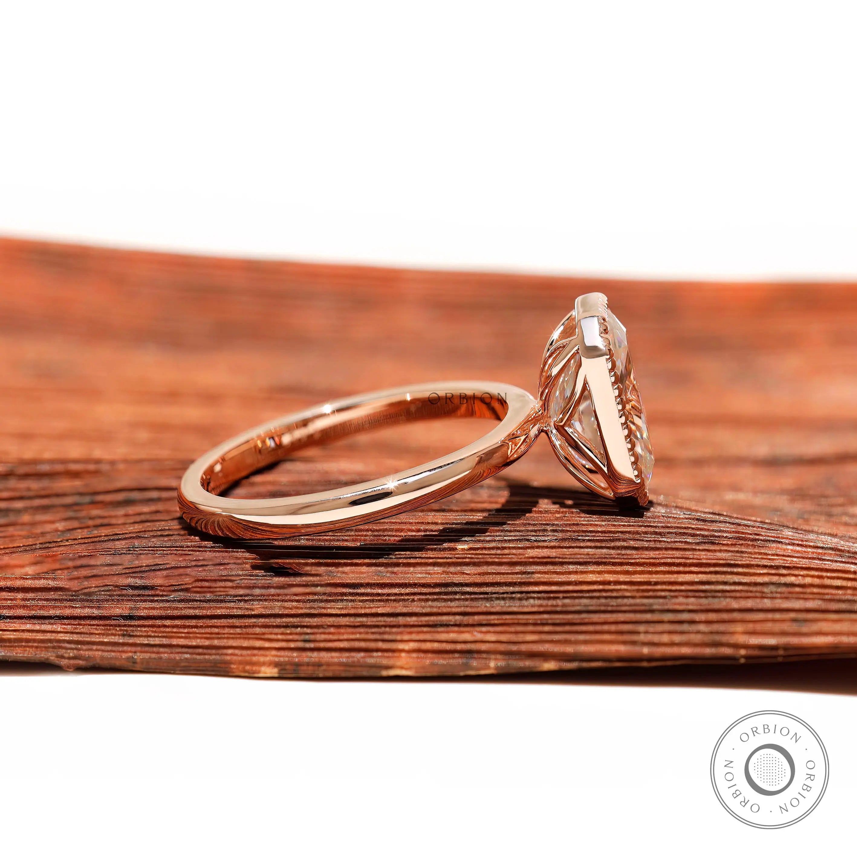 Side profile of bezel set radiant moissanite ring