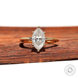 Front view marquise moissanite 6-prong solitaire ring in yellow gold.