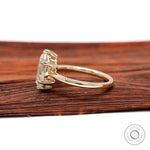 Side profile view highlighting six-prong basket setting and polished band.