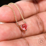 Angled side view of heart diamond pendant showing gold basket setting