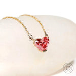 Three-quarter view of heart diamond pendant sparkle and chain details