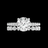 Front view round moissanite solitaire with matching diamond bands
