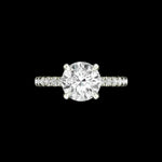 Front view of round solitaire ring with side stones