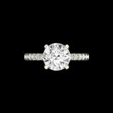 Front view of round solitaire ring with side stones