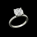 Angled view of round solitaire engagement ring in white gold