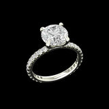Angled view of round solitaire engagement ring in white gold
