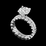 Angled view showing prong set round moissanite bridal set