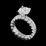 Angled view showing prong set round moissanite bridal set