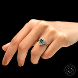 Elegant pear shaped blue green moissanite ring on fingure