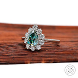 Side profile of pear teal moissanite halo ring