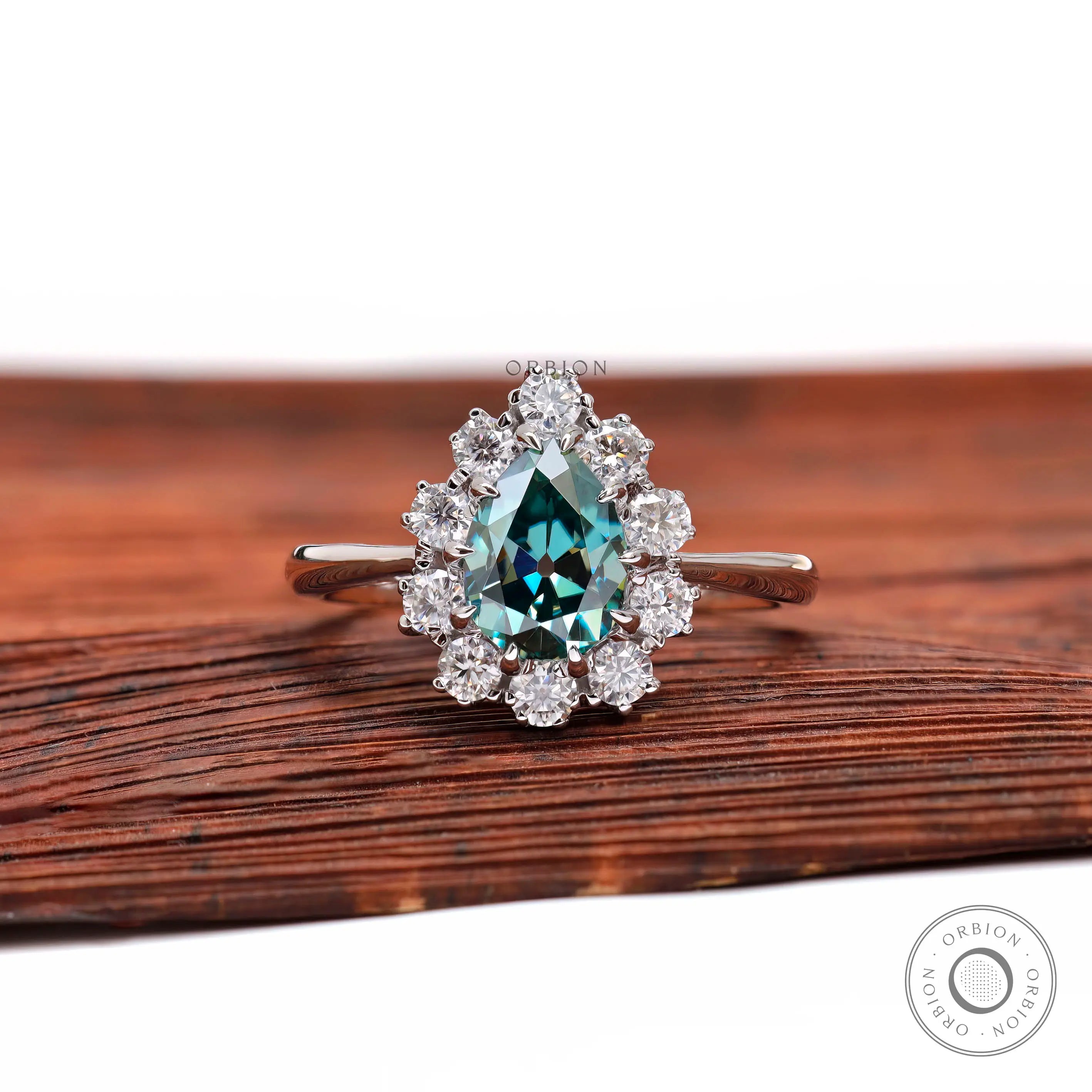 Pear blue green moissanite halo engagement ring front view